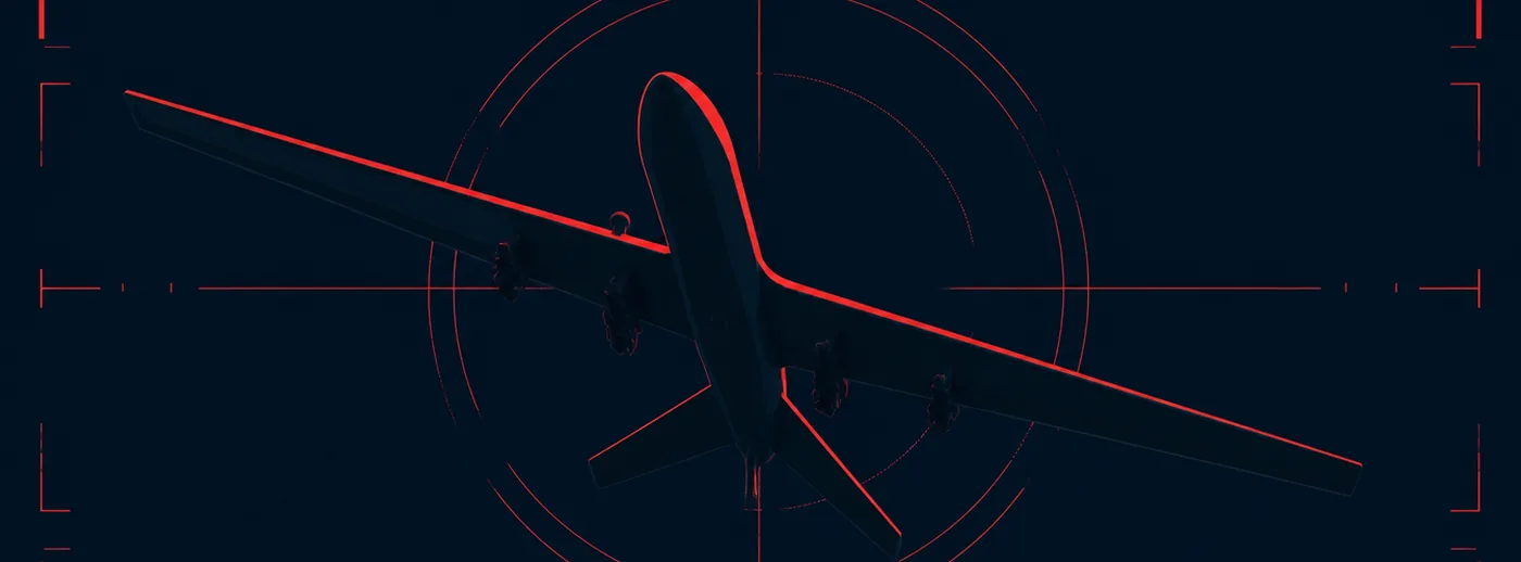 Silhouette di un drone vista dal basso contro un cielo scuro, attraversata da linee rosse di puntamento